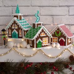 a christmas scene with gingerbread houses and lights