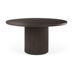 an oval dining table in dark brown with a circular top and pleated design on the base