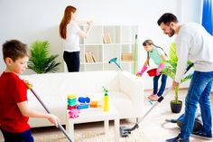 the family is cleaning the living room together