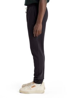 Elevate your casual look with our Essential Logo Sweatpants. Made from 100% cotton, these sweatpants feature a classic closed bottom with elastic around the hem to maintain a snug fit at your ankles and legs. Whether you're hitting the gym or relaxing at home, these sweatpants provide both comfort and style. 100% Cotton Wash - 30 Degrees Normal Sporty Sweatpants With Comfort Stretch And Elastic Side Panels, Sporty Comfort Stretch Sweatpants With Elastic Side Panels, Relaxed Fit Sweats With Tapered Leg, Relaxed Fit Activewear With Ribbed Cuffs And Tapered Leg, Relaxed Fit Sweats With Ribbed Waistband And Tapered Leg, Relaxed Fit Full Length Sweatpants For Elevated Casual Wear, Sporty Relaxed Fit Sweatpants For Casual Wear, Comfortable Relaxed Fit Sweatpants For Elevated Casual, Everyday Athleisure Bottoms With Straight Hem