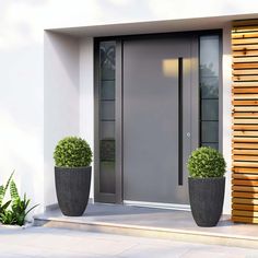 two large planters are next to the front door