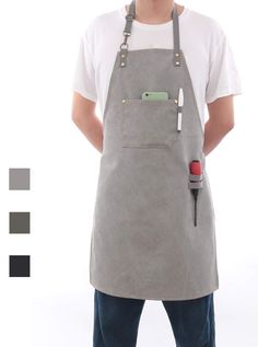 a man wearing an apron with a cell phone in the back pocket and two different color swatches