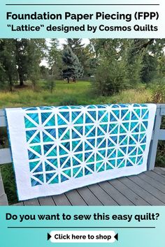 a blue and white quilt sitting on top of a wooden deck next to trees with the words, foundation paper piecing fpp lattice designed by cosmos quilts