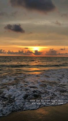 the sun is setting over the ocean with a bible verse on it's side