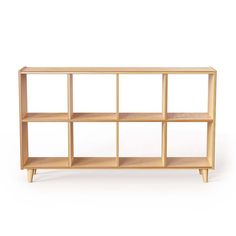 a wooden shelf with six shelves on each side and one section open to reveal the contents