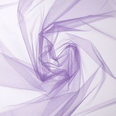 Add a decorative and dainty touch to sewing and craft projects with Violet Nylon Tulle Fabric. This tulle is perfect for adding to elegant and classic dresses, blouses, and skirts or for using with wedding decor, favors, gift packaging and more. Combine your finished products with beads, buttons and zippers for extra special creations!     Details:   Width: 54"  Weight: Sheer  Country Of Origin: Mexico  Content: 100% Nylon  Care: Machine Wash, Warm; Tumble Dry, Remove Promptly.      Available in Tulle Flowers, How To Wrap Flowers, Home Decor Crafts, Color Lila, Razzle Dazzle, Diy Projects Videos, Floral Shop, Print Coupons, Floral Supplies