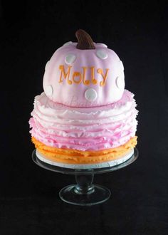 a cake that is sitting on top of a glass plate with the word moly written on it