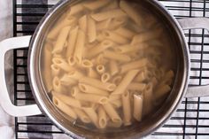 a pot filled with pasta on top of a stove