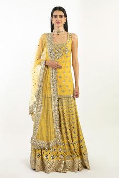 Yellow sleeveless kurta with floral embroidery in gota, mirror and zari. Paired with embroidered sharara and scallop embroidered dupatta.
Components:3
Pattern:Embroidered
Type of Work:Gota, Mirror and Zari
Neckline:Scoop
Sleeve Type:Sleeveless
Fabric:Kurta and Sharara: Chanderi, Dupatta: Net
Color:Yellow
Other Details:
Scallop dupatta
Floral motifs
Embroidered sharara
Occasion:Bride, Destination Wedding - Aza Fashions Abhinav Mishra, Kurta And Sharara, Sleeveless Kurta, Yellow Mirrors, Kurta Sharara Set, Chanderi Dupatta, Kurta Sharara, Spring Couture, Sharara Set