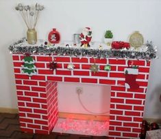 a red brick fireplace with christmas decorations on top