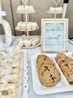 cookies and muffins are on display at a wedding reception