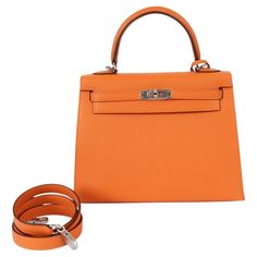 100% authentic Hermès Kelly 25 Sellier bag in orange Veau Epsom leather with palladium hardware. Lined in Chevre (goat skin) with an open pocket against the front and a zipper pocket against the back. Brand new - comes with fullset. Measurements Height 19cm (7.4in) Width 25cm (9.8in) Depth 9cm (3.5in) Hardware Palladium Blindstamp B (2023) All our listings include only the listed item unless otherwise specified in the description above Kelly 25 Sellier, Hermes Kelly 25, Kelly 25, Hermes Orange, Tassel Bag, Hermes Bags, Bags Shoes, Fashion Handbags, Bags Handbags