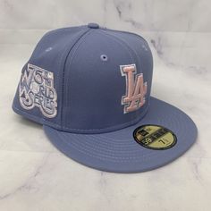 the los angeles dodgers'new era cap is shown in blue and gold, with embroidered logos