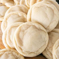 a pile of cookies sitting on top of a wooden table