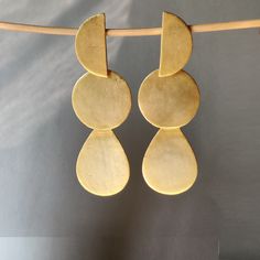 "PRODUCT DESCRIPTION  Specifications: Handmade Earrings Brass Gold Plated Dangle Drop Earrings Round Design Minimalistic Simple Hanging Earring Jewelry Christmas Gift for her   Plating : 18K Gold Plated  WEIGHT: Earring Weight : 23.50Grms SIZE: Jewelry Size:3.30*0.75\" Item Code:  E/TJBE/0063A" Brass Long Drop Chandelier Earrings As Gift, Matte Gold Dangle Earrings Gift, Matte Gold Dangle Earrings, Brass Linear Drop Earrings As Gift, Brass Drop Linear Earrings For Gift, Hanging Earring, Earrings Round, Christmas Gift For Her, Jewelry Christmas