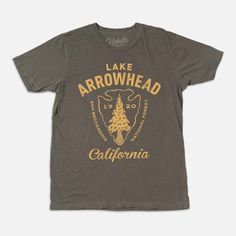 This Lake Arrowhead CA California T-shirt features a hand illustrated image. Artwork is designed and printed in Los Angeles, and is printed on a 100% USA made, unisex T-shirt. Shirt is garment dyed and washed. Styling is vintage aesthetic.  * 40 Singles Jersey 100% Cotton * Premium quality ring spun and compacted cotton * 3.5 oz * This is a leaner fit * Colors are soft and vintage looking * Made In USA https://www.habilissupplyco.com Graphic Tee With Front Print In Ring-spun Cotton, Acid Wash Crew Neck T-shirt With Screen Print, Acid Wash T-shirt With Front Print And Crew Neck, Casual Acid Wash T-shirt With Graphic Design, Acid Wash T-shirt With Front Print And Relaxed Fit, Graphic Tee With Screen Print In Ring-spun Cotton, Acid Wash Tri-blend Graphic Tee, Retro Screen Print T-shirt In Ring-spun Cotton, Acid Wash T-shirt With Graphic Band Merch Design