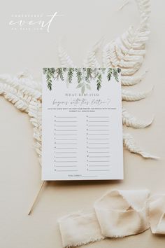 a white and green palm leaf themed baby shower game