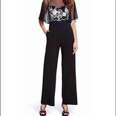 Adrianna Papell Ap1e205755 Flared Sleeve Embroidered Mesh Jumpsuit In Black Size 4. Has A Bateau Neckline With Flutter Sleeves. The Fitted Bodice Is Designed With Floral Embroidery. The Back Has A Zipper Closure While The Full Length Leg Pants Are Styled With Pockets. Elegant Embellished Jumpsuits And Rompers For Spring, Chic Evening Jumpsuits And Rompers For Festive Occasions, Embroidered Jumpsuits And Rompers For Summer Parties, Elegant Festive Evening Jumpsuits And Rompers, Elegant Embroidered Jumpsuits And Rompers For Party, Elegant Floral Embroidered Pants For Party, Elegant Pants With Floral Embroidery For Party, Tuxedo Jumpsuit, Mesh Jumpsuit