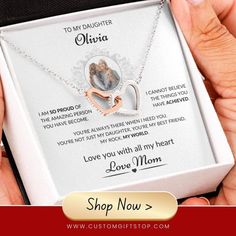 a woman's personalized necklace in a box with the message to her daughter on it