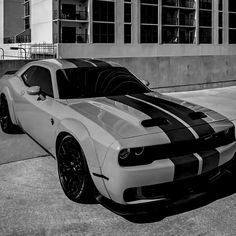 a black and white photo of a sports car