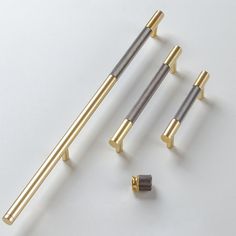 three different types of brass and silver screws