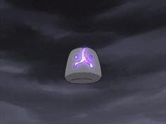 a purple and white object floating in the air on a cloudy night with dark clouds