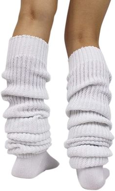 the legs and ankles of a woman wearing white socks with knits on top of them