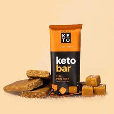 a bag of keto bar sitting next to some pieces of chocolate and caramel