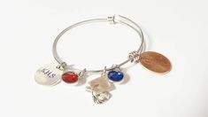 "Want something unique for that special young lady's graduation from High School or College? How about an personalized bracelet with a real US penny (hole punched) from their graduation year, a hand stamped disc with school initials, 2 school color crystal charms and top it off with a graduation cap and diploma! This beautiful stainless steel bracelet will show them how much thought you put into this momentous occasion! Details: standard expandable size (fits most) 65mm stainless steel bracelet, Graduation University, Penny Bracelet, Class Of 2023 Graduation, Graduation College, Us Penny, 2023 Graduation, Bat Mitzvah Gifts, Graduation Year, College Graduation Gifts