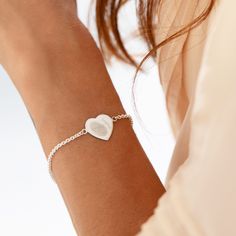 Elevate the art of gift-giving with our Silver Fingerprint Heart Bracelet--a timeless expression of love and connection. The heart-shaped charm at the centre holds a deeply personal touch, featuring the engraved fingerprint of your loved one along with their name creating a uniquely crafted symbol of the special bond you share. The adjustable chain ensures a perfect fit, allowing the bracelet to gracefully adorn any wrist. Flip the heart charm to reveal a canvas for personalisation--add a name, a significant date, or a heartfelt message, turning this exquisite piece into a cherished memento. Delivered in an elegant gift box, the Silver Fingerprint Heart Bracelet is a thoughtful and sentimental gift for any occasion--a beautiful reminder of the timeless connection you both hold dear. Celebr Classic Heart Pendant Bracelet As Gift, Heart-shaped Engraved Bracelets For Anniversary, Classic Heart Charm Bracelet As Gift, Classic Heart Charm Bracelet Gift, Heart-shaped Engraved Bracelets For Wedding, Engraved Heart Bracelet For Anniversary, Heart-shaped Engraved Wedding Bracelets, Engraved Heart Shaped Bracelet For Gift, Engraved Heart-shaped Bracelet For Gift