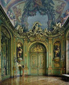 an ornately decorated room with painted ceilings