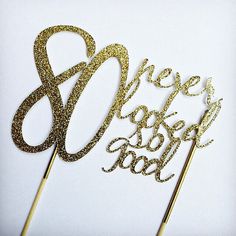 there is a cake topper that says 80 years old and gold glitter on it