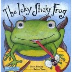 the lucky frog is sitting on top of a plate with spoon and fork in it