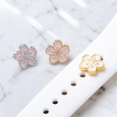 Sakura Floral Apple Watch Charms, Watch Stud, Watch Band Jewellery, Apple Watch, Samsung Strap Charm, one piece only ✨ Be Unique and Look Fantastic for your Apple Watch / Samsung Galaxy Watch with a set of personalized Charms.  ✨ Make your watch more attractive highlight. ✨ the set charms fit for Apple Watch silicon pin & Samsung Galaxy Watch band which using 20mm pins silicon strap.  e.g. Samsung Galaxy 4 / 5  ✨ the Charms can mix and match with your styles. These handmade strap accessories are the perfectly match with any silicon smartwatch and can be stacked together or used individually.  ✨ A prefect gift for your beloved, BFF, family members, perfect gift for her, the perfect birthday gift, gifts for Valentine's Day, Mother's Day, Christmas Gifts.  ✨It takes 3-5 business days to proce Apple Watch Charms, Watch Charms, Apple Watch 3, Samsung Galaxy Watch, Band Jewelry, Silicon Bands, Perfect Gift For Her, Watch Band, Watch Bands