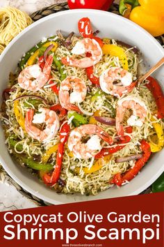 a white bowl filled with shrimp and veggies on top of a marble counter