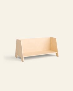 a wooden shelf sitting on top of a white wall