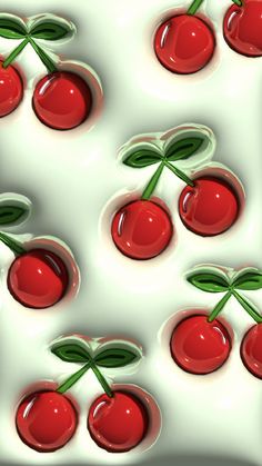 several cherries with green leaves on them are floating in the air and surrounded by smaller cherries