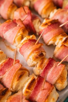 bacon wrapped pretzels on skewers with toothpicks in the middle