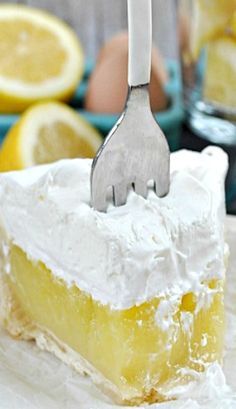 a piece of lemon cake with a fork stuck in it