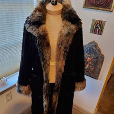 Black Faux Fur Maxi Coat With Fur Trim Brand: Wraps By Canvasbacks Looks Right Out Of The 70's With A Vintage Look Tag: Xs But Is A Roomy Size (M) Black Faux Fur Is Has A Ribbed, Corrugated Texture (Pic 5) 3 Hook Closures And Can Also Be Worn Open 2 Deep Square Pockets Faux Fur Trim Is Black, Cream, And Chestnut Brown Quite Heavy And Very Comfortable Due To Smooth, High Quality Lining Perfect Condition! Shoulders: 16 In; Pit2pit: 19 In; Length: 49 In; Hips: 21 In; Sleeves: 22 In Fitted Black Fur Coat For Fall, Brown Fitted Faux Fur Outerwear, Black Fitted Fur Coat For Cold Weather, Fitted Black Fur Coat For Cold Weather, Fitted Mink Outerwear For Cold Weather, Vintage Black Fur Coat For Fall, Black Vintage Fur Coat For Fall, Coat With Fur Trim, Coat With Fur