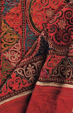 an intricately designed red and blue cloth