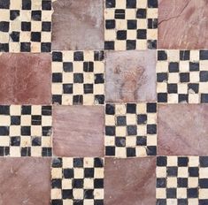 a checkerboard pattern is shown in black, white and brown colors on the floor