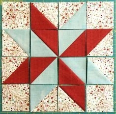 the block is made up of red and blue blocks, with white flowers on them