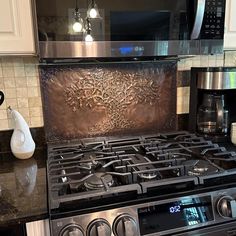 a stove top oven sitting inside of a kitchen