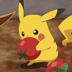 two pikachu are playing with each other in front of some tomatoes and carrots