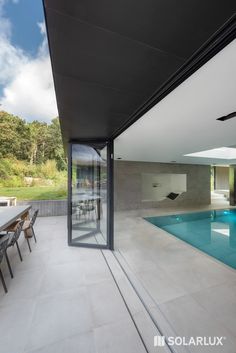 an empty swimming pool in the middle of a house