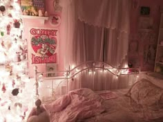 a bedroom decorated in pink and white with lights