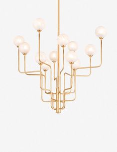 a gold chandelier with white glass balls hanging from it's center point