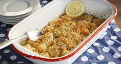 a casserole dish with lemon and bread crumbs