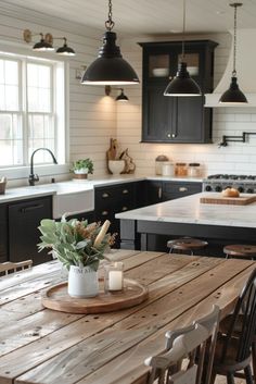 a wooden table sitting in the middle of a kitchen